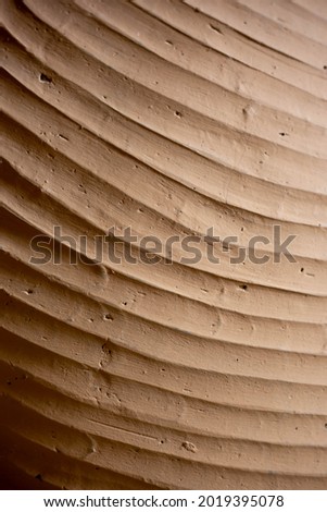 Pattern of texture clay house structure. Wall of soil house. Mud background and vintage tone, soft picture
