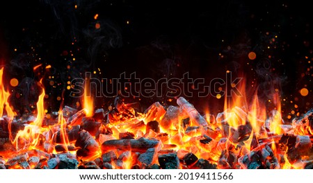Charcoal for Barbecue Background With Flames Royalty-Free Stock Photo #2019411566