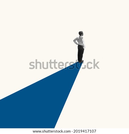 Successful businessman standing on blue line, way or path to success and goal. Right direction. Concept of finance, economy, professional occupation, business and career.
