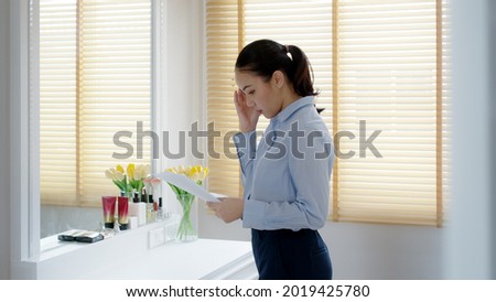 Young female leader, asia people lady or mba student standing look in front of mirror fear tired pep talk for sale pitch hold paper document script public speak skill for job career lost self improve. Royalty-Free Stock Photo #2019425780