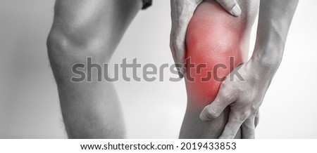 man with muscle pain on grey background. Elderly have knee ache due to Runners Knee or Patellofemoral Pain Syndrome, osteoarthritis, arthritis, rheumatism and Patellar Tendinitis. medical concept Royalty-Free Stock Photo #2019433853