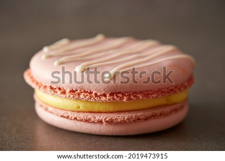 Strawberry butter macarons on gray background