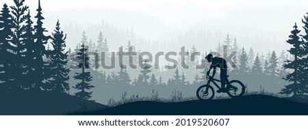 Horizontal banner. Silhouette of mountain bike rider on meadow in forrest. Silhouette of biker, trees, grass. Magical misty landscape, fog. Blue and gray illustration. Bookmark.