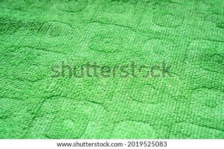 Green microfiber rag surface background