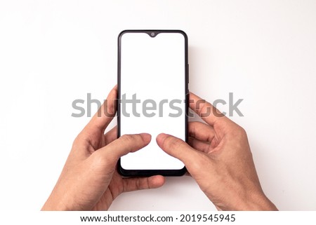 holding a phone on a white background