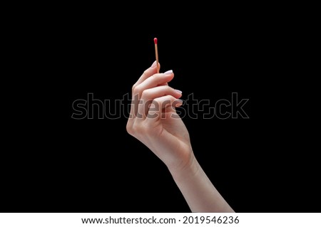 Hand with a match or matchstick off isolated on black background. Concept hands and fire Royalty-Free Stock Photo #2019546236