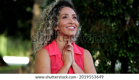 Hopeful hispanic woman taking a deep breath relaxing outside looking at sky with HOPE and FAITH. Royalty-Free Stock Photo #2019553649
