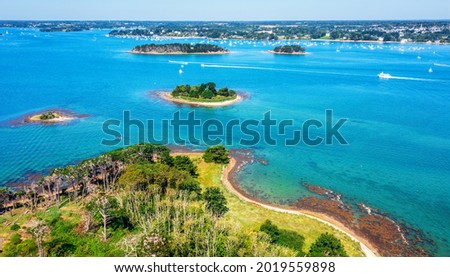 Small islands scattered in the blue water of the Gulf of Morbihan on atlantic coas of Brittany, France Royalty-Free Stock Photo #2019559898