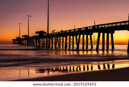 Jennette's Fishing Pier in Nags Head , North Carolina at sunrise. Royalty-Free Stock Photo #2019569693