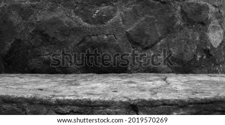 A Concrete Moulding, Showing a Very Old Semi Circle Base with Imprints and Grit to the Surface, For a Product Display with a Natural Stone Blurred Foreground and Background. Royalty-Free Stock Photo #2019570269