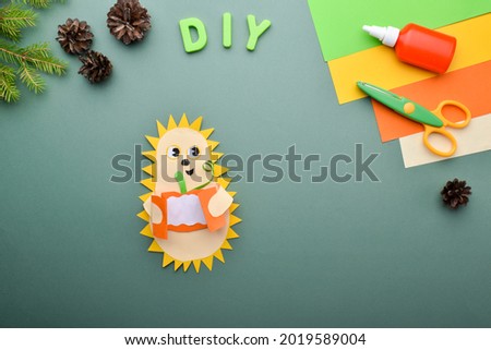 DIY with children hedgehog with pumpkin. A greeting card for Halloween. Detailed step-by-step instructions. back to school