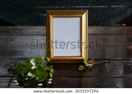 Bright cinematic photo frame with a blossoming branch. Minimalistic mockup.