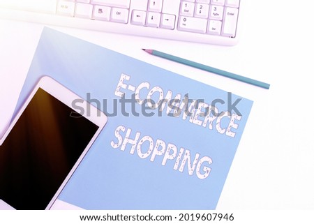 Hand writing sign E Commerce Shopping. Business showcase directly buy goods or service from a seller over the web Display of Different Color Sticker Notes Arranged On flatlay Lay Background