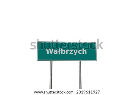 Green city board on a pole with the inscription Wałbrzych, Polish city isolated on a white background