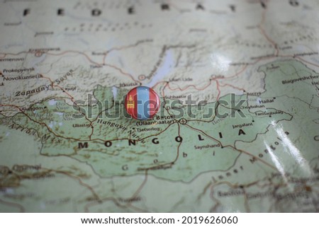 Mongolia flag drawing pin on the map