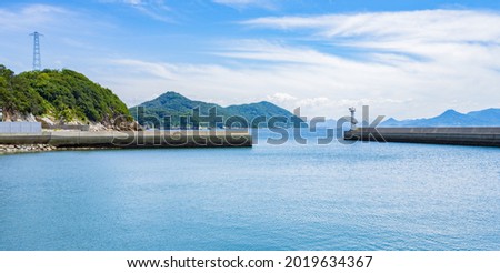 Beautiful Landscape of Seawall or Breakwater in The Blue Sea or Ocean at The Port or Harbor in Summer, Summer Vacation or Travel Background, Ogijima Island in Kagawa Prefecture in Japan, Nobody Royalty-Free Stock Photo #2019634367