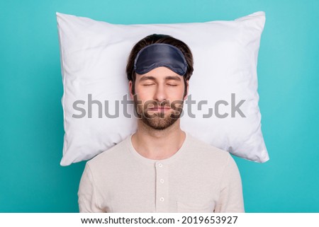 Top above high angle view photo of young man lying pillow sleep night drowse comfort isolated over teal color background