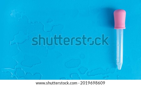 A water drop on a blue background.