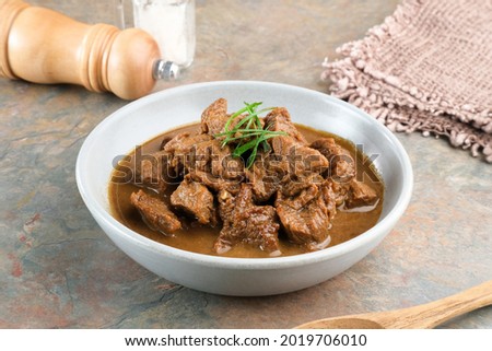
Daging Kelem is a traditional food from Central Java, Indonesia, made from beef, coconut milk and spices. It tastes sweet and savory. Served in bowl, close up. Royalty-Free Stock Photo #2019706010