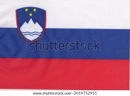 Slovenia flag
White, middle - blue and bottom - red, with the image of the coat of arms of Slovenia in the canopy. The ratio of the flag's width to its length is 1: 2.