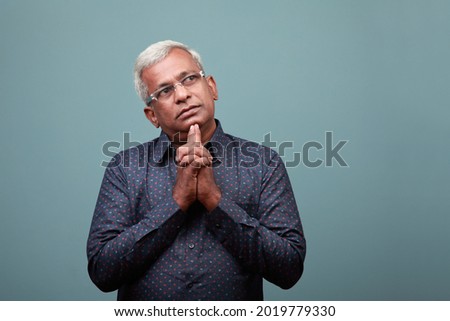 Elderly man of Indian ethnicity with a thinking face Royalty-Free Stock Photo #2019779330