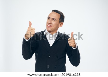 a man in a suit gestures with his hands emotions office manager