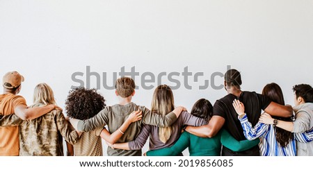 Rearview of diverse people hugging each other Royalty-Free Stock Photo #2019856085