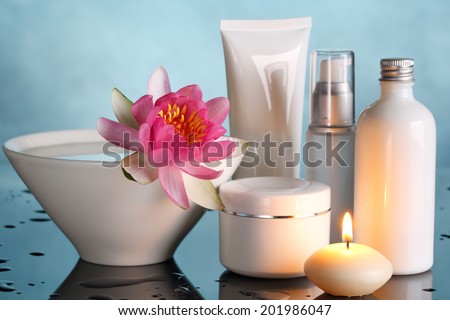 Perfume bottles with lotus flower Royalty-Free Stock Photo #201986047