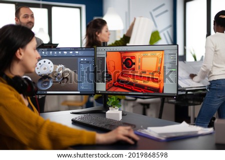 Engineer developer analyzing cad software to develop creative video game, working in startup gaming company for prototype. Design technician studying on computer developing new online games
