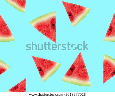 Slices of watermelon on a blue background. Watermelon seamless pattern.