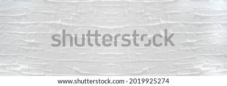 Old wooden texture, painted white, wallpaper and background. The texture of white paint in cracks.Empty wooden surface, top view, panoramic view