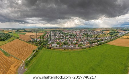 Panoramic drone picture of the southern Hessian town of Dornheim during an approaching thunderstorm and heavy rainfall during daytime