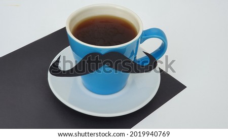 A decorated coffee cup, on the table. Happy Father's Day concept. Birthday.