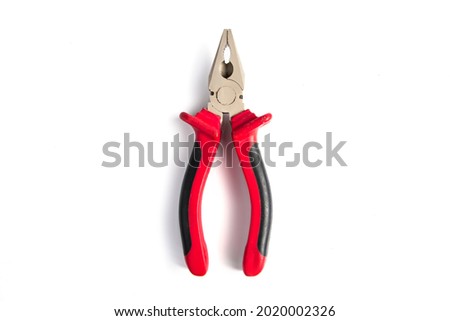 Pliers with red insulating handles on a white background. Working tool for repair. Royalty-Free Stock Photo #2020002326