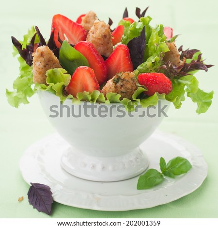 Salad with chicken and strawberry, selective focus