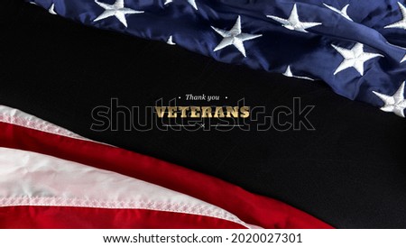 Top view flag of the United States of America and inscription with congratulations over black background. Independence Day USA, Memorial Day and Veterans Day concept
