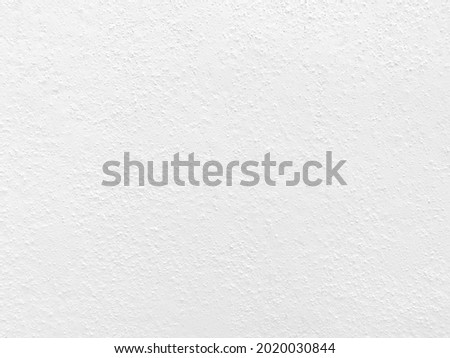 Seamless texture of white cement wall a rough surface, with space for text, for a background.	
