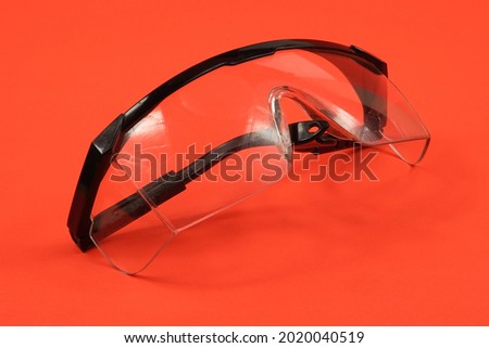 Transparent safety glasses for work that is quite dangerous.  Royalty-Free Stock Photo #2020040519