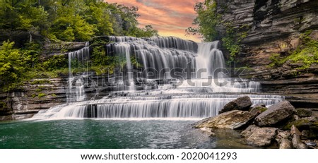 A beautiful waterfall in middle Tennessee. This hike requires a stroll through the river to get to the falls.  Royalty-Free Stock Photo #2020041293