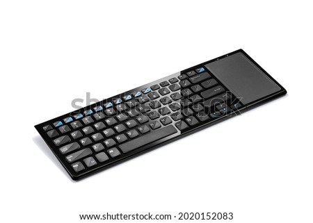 Side view of modern wireless keyboard with touch pad isolated on white background Royalty-Free Stock Photo #2020152083