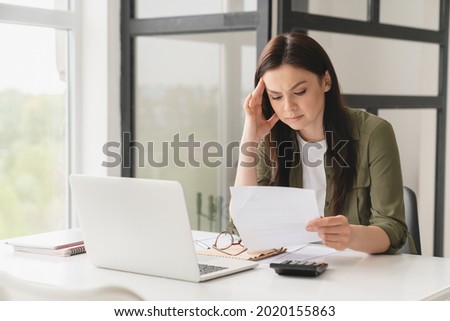 Bankrupt. Young tired stressed overworked businesswoman freelancer teacher student exhausted after hard work, suffering from migraine headache at office. Deadline, fired worker, debt, problems concept Royalty-Free Stock Photo #2020155863