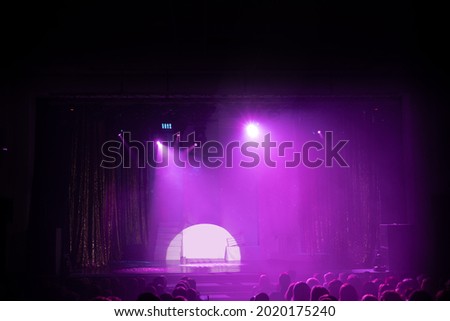 before the performance on scene theater, stage light with colored spotlights and smoke.