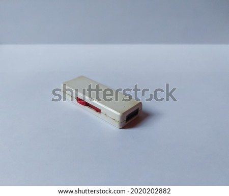 a plastic disk photographed on a white background