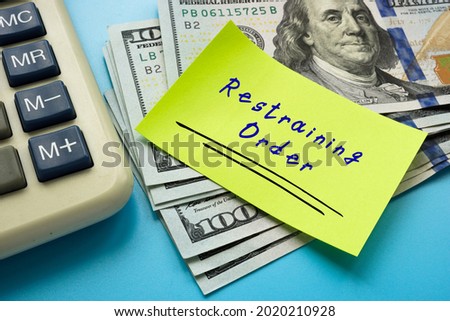 Business concept meaning Restraining Order with inscription on the piece of paper. 
 Royalty-Free Stock Photo #2020210928