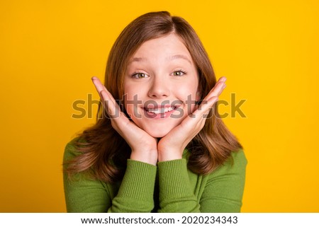 Photo portrait smiling cute in casual outfit happy hands near face isolated bright yellow color background