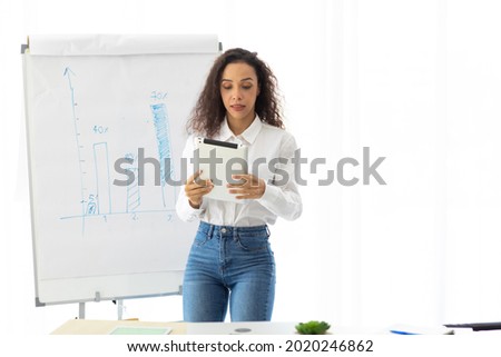Hispanic girl dancing on white background in home office. business woman dance in presentation.