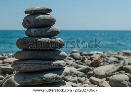 Relax on a pebbles beach in summer