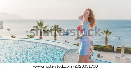 Nice relax at tropical resort, concept of vacation, pretty woman at pool rest under sun