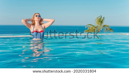 Nice relax at tropical resort, concept of vacation, pretty woman at pool rest under sun