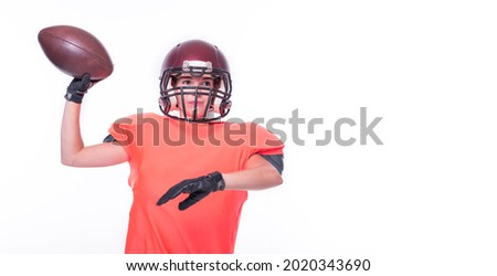 Woman in the uniform of an American football team player throws the ball. Sports concept. Mixed media
